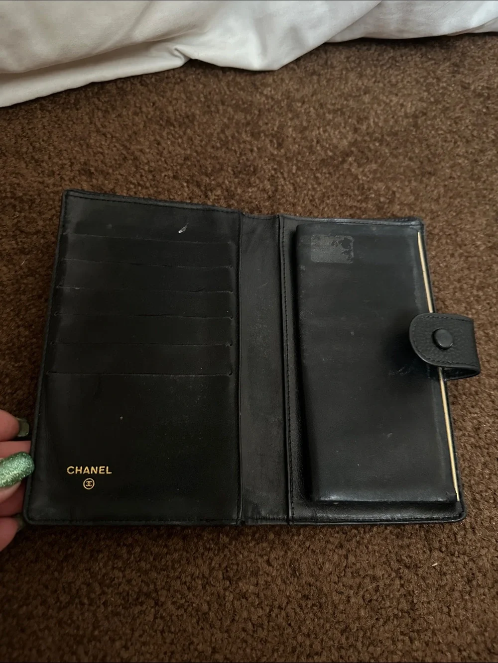 CHANEL Black Quilted CC Caviar Leather wallet.